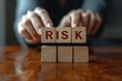 © Mariya - Risk Management Strategy Person Stacking Wooden Blocks for Business Planning and Decision Making