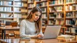 © mdmubarak - Serous thoughtful young university student girl typing on laptop in public library, thinking on report, article, essay, research paper, studying on Internet, sitting at table with open books
