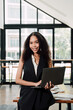 © Kritdanai - Confident Businesswoman with Laptop