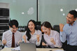 © ARMMY PICCA - Group of Young Asian business team creative businesspeople coworker in office Happy to be successful partnership teamwork celebrating achievement and success concept.