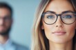 © Tee - Professional woman in glasses with confident expression.