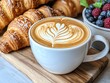 © LittleDreamStocks - A creamy latte with artistic foam next to freshly baked croissants, Coffee and Bakery, coffee latte