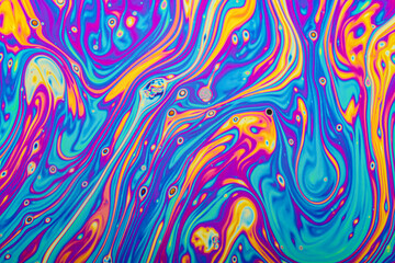 Wall Mural - Real photograph of a colorful light interference on a soap bubble surface with random swirls, curves and lines