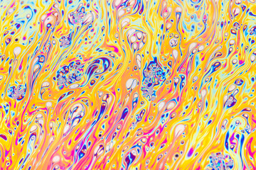 Wall Mural - Real photograph of a colorful light interference on a soap bubble surface with random swirls, curves and lines