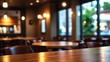 © EkoSugi - Wood table top with reflect on blur of lighting in cafe,restaurant background/selective focus