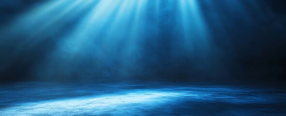 Leinwandbilder - A serene blue light beams down onto a tranquil surface, creating an ethereal atmosphere reminiscent of underwater or stage lighting.