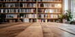 © Art Fusion - Blurred image focusing on a wooden table with a blurred bookshelf and decor in the background home office vibe soft lighting