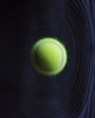 A vibrant green tennis ball in motion, creating a dynamic swirl against a dark background.