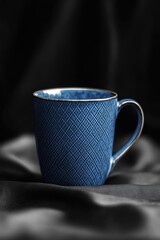 Wall Mural - Blue Coffee Cup on Black Cloth