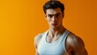 © daniel - Man in workout clothes poses against a vibrant orange background during fitness session