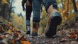 © mbah - Close-up of hikers' boots on autumn trail.