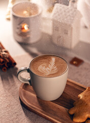 Wall Mural - Warm cappuccino on a wooden tray