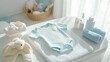© Terry - A cute little onesie laid out on a changing table, surrounded by baby care items in pastel shades.