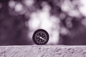 Wall Mural - classic navigation compass on natural background