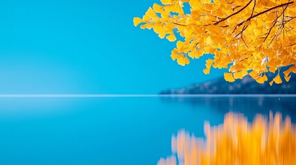 Wall Mural - A tree with yellow leaves on the side of a body of water