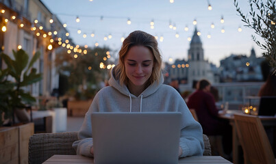 Wall Mural - Woman Using Laptop on Rooftop Terrace