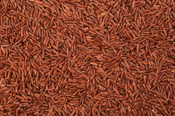 Wall Mural - red rice as a background. Top view. Flat lay