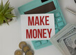 © Pawel - MAKE MONEY text for business concepts. The words make money written in a notebook on a white table.