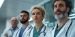© c80 - A diverse group of doctors wearing white coats stands confidently in a hospital hallway, representing professionalism and healthcare teamwork.