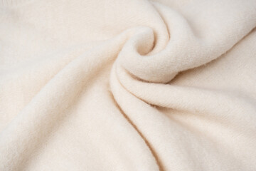 Beige sweater texture as a background.