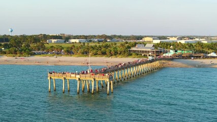 Canvas Print - Aerial view of many tourists enjoying vacation time on Venice fishing pier. Seaside summer activities