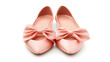 © wikanda - Flat, light pink ballet flats, crossed neatly with a bow on top