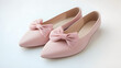 © wikanda - Flat, light pink ballet flats, crossed neatly with a bow on top