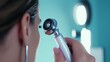 © decle - A close-up of a medical professional using an otoscope to examine a patient's ear, set against a softly lit examination room with clinical decor, macro shot