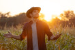© kamonrat - Farmer Enjoying the Sunset in a Cornfield, Embracing Nature and the Golden Light, Representing Connection with the Land, Agriculture, and Peaceful Moment at the End of a Productive Day