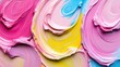 © somsri - Vibrant Swirls of Pink, Yellow, and Blue Acrylic Paint Blending Together in a Rich Abstract Composition on Canvas for Artistic Inspiration and Creativity