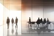 © khalid_spk - Modern office space glass walls conference room business meeting silhouettes blurred figures professional setting