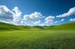 © guolin - A vast grassland under a blue sky with fluffy white clouds in Inner Mongolia, showcasing the natural beauty and expansive landscape, perfect for a peaceful and tranquil outdoor setting.