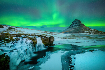 Wall Mural - aurora borealis or northern lights over kirkjufell mountain in iceland