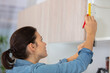 © auremar - woman working on a new kitchen installation