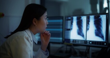 Aufkleber - Portrait of an Asian Female Radiologist Examines Chest X-rays on Multiple Monitors in a Dark Medical Office. Healthcare Professional Focused on Analyzing Detailed Medical Imagery of a Patient