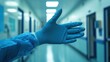 © dominic - Gloved Hand Reaches Out in Hospital Corridor, Healthcare, Medical