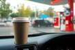 © DavidGalih | Dikomo. - Paper Coffee Cup on Car Dashboard at Gas Station Mockup