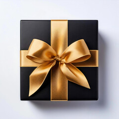 Wall Mural - Elegant black gift box with golden ribbon bow isolated on white background, flat lay, top view	