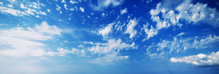 Wall Mural - background of blue sky with white fluffy clouds. Panorama of the sky in the morning in summer