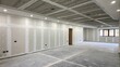 © DigitalSpace - A stark room featuring freshly sanded drywall its surface showing faint marks from the sanding process and a muted gray concrete base beneath.