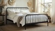 © santi - Modern bedroom design with a black metal bed frame, crisp white linens, and a soft area rug.