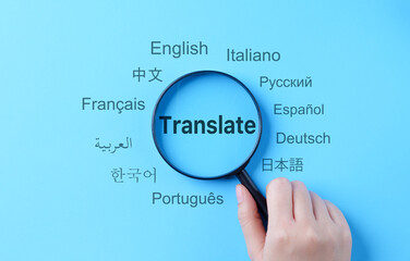 translation and multilingual communication concept. a magnifying glass highlights the word 