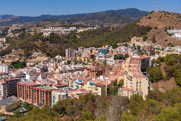 Wall Mural - Malaga, Spain - August 06, 2024: Views of the city and the Cathedral of the Incarnation of Malaga from the Gibralfaro Castle in the city of Malaga, Andalusia. Spain