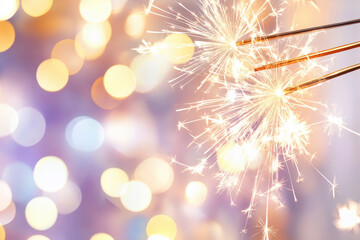 Wall Mural - bright sparklers with a purple and gold bokeh background