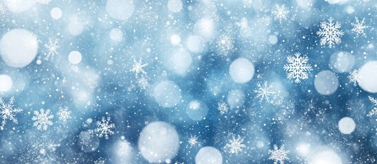 Poster - Bokeh effect of white snowflakes on a blue background creating a dreamy winter holiday atmosphere with a magical starry aesthetic