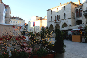 Wall Mural - Christmas decorations and historical buildings on People's Square in Split, Croatia. Sunny winter day in Croatia.