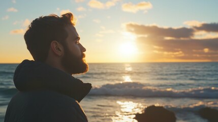 Man standing by a calm sea at sunrise, serene and reflective, natural and peaceful, warm light, meditative and tranquil, gentle waves.