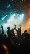 © Oleksandr - Captivating concert atmosphere as audience enjoys live music, hands raised amidst dramatic lighting and confetti, capturing the essence of a night to remember.