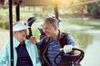 © peopleimages.com - Couple, smile and golf cart for sports, game and recreation with weekend hobby, bonding and fitness. Senior people, love and happy on course for exercise, retirement and club competition with leisure