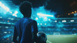 © Pavithiran - Unrecognizable football player in blue shirt holding soccer ball while standing on stadium. Generative AI
